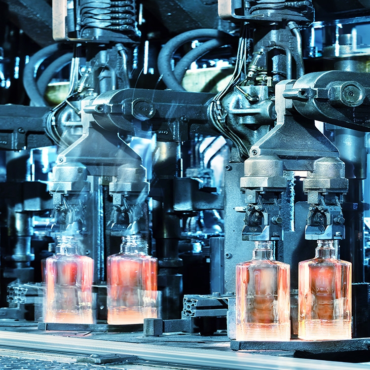 Glass bottles in a forming machine